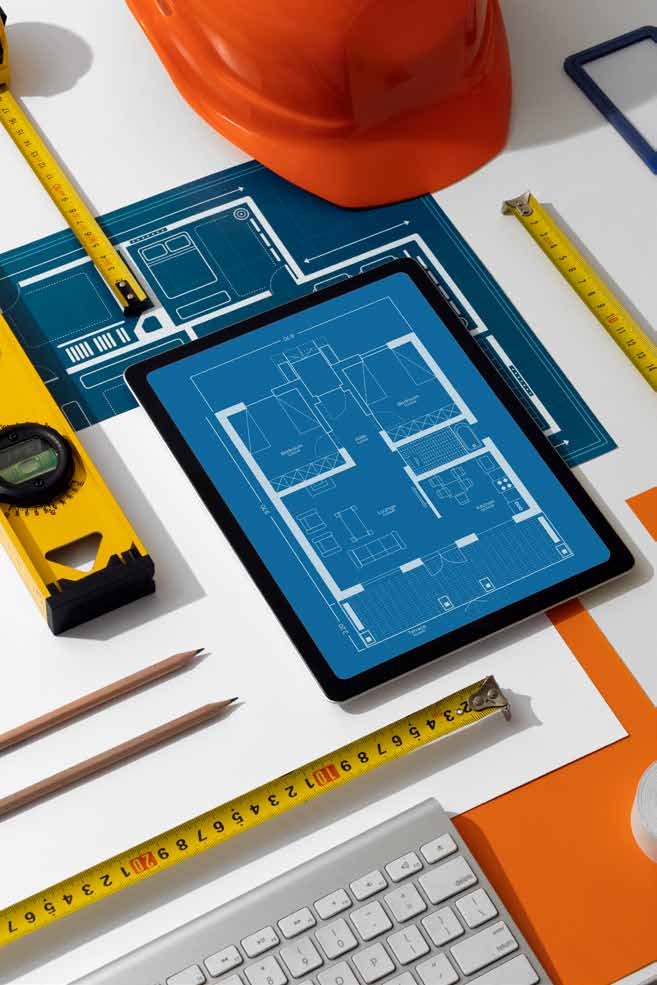 Blueprints, hard hat and measuring tools for MGP civil works